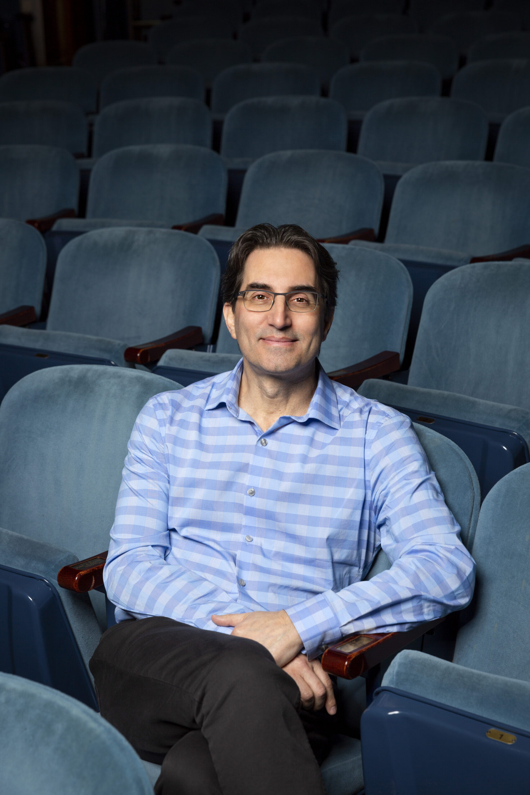 Michael Unger Sitting in Theatre Seats