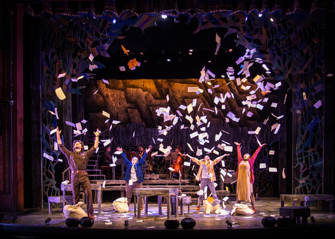 THE SPITFIRE GRILL Actors with raining paper on stage