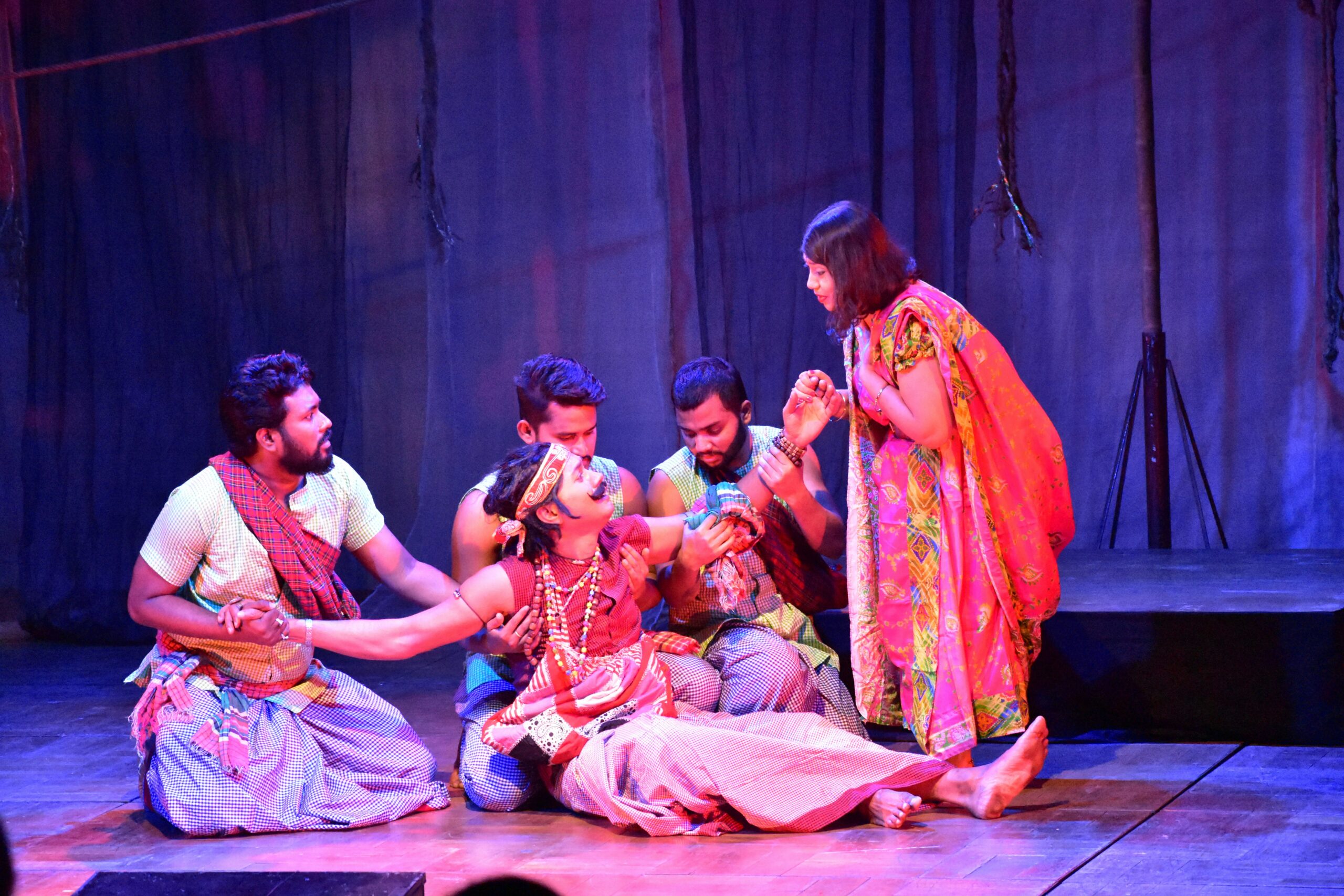 Actors on stage performing