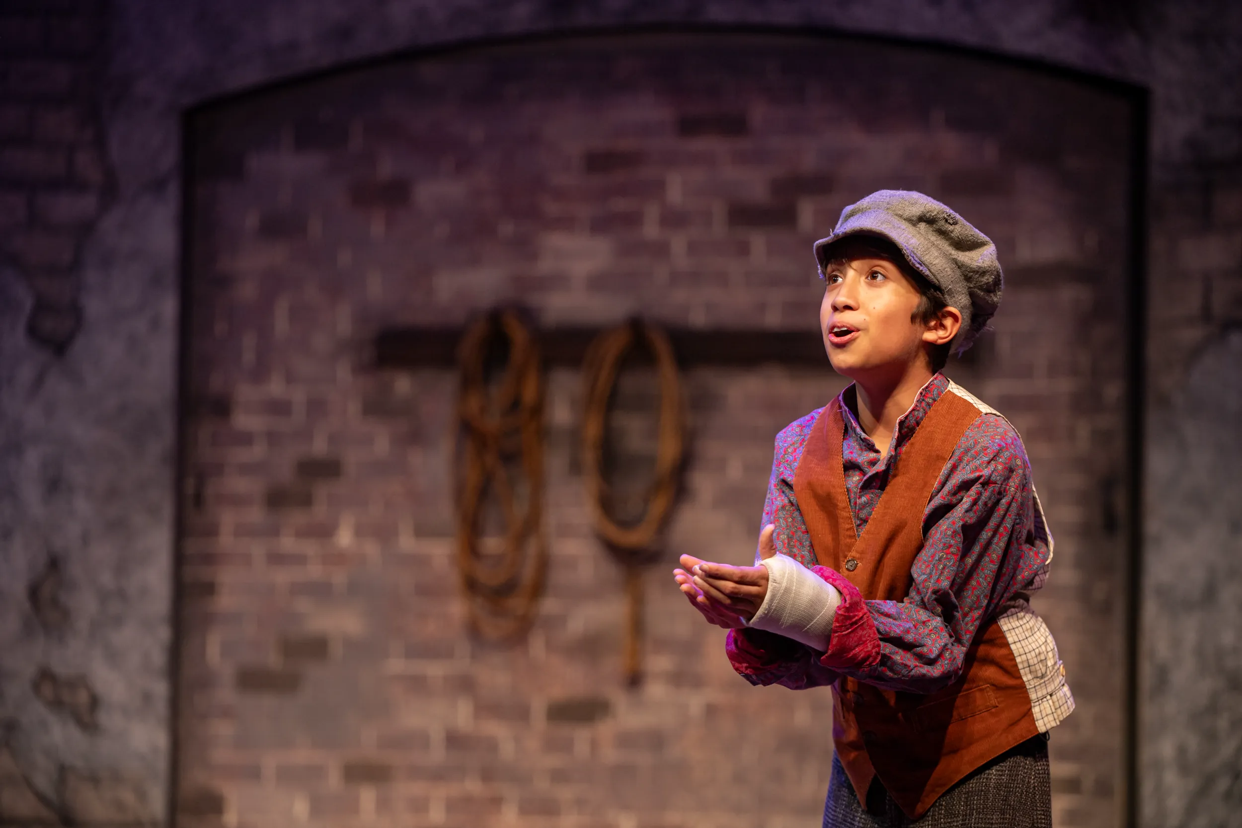Actor in Oliver on stage