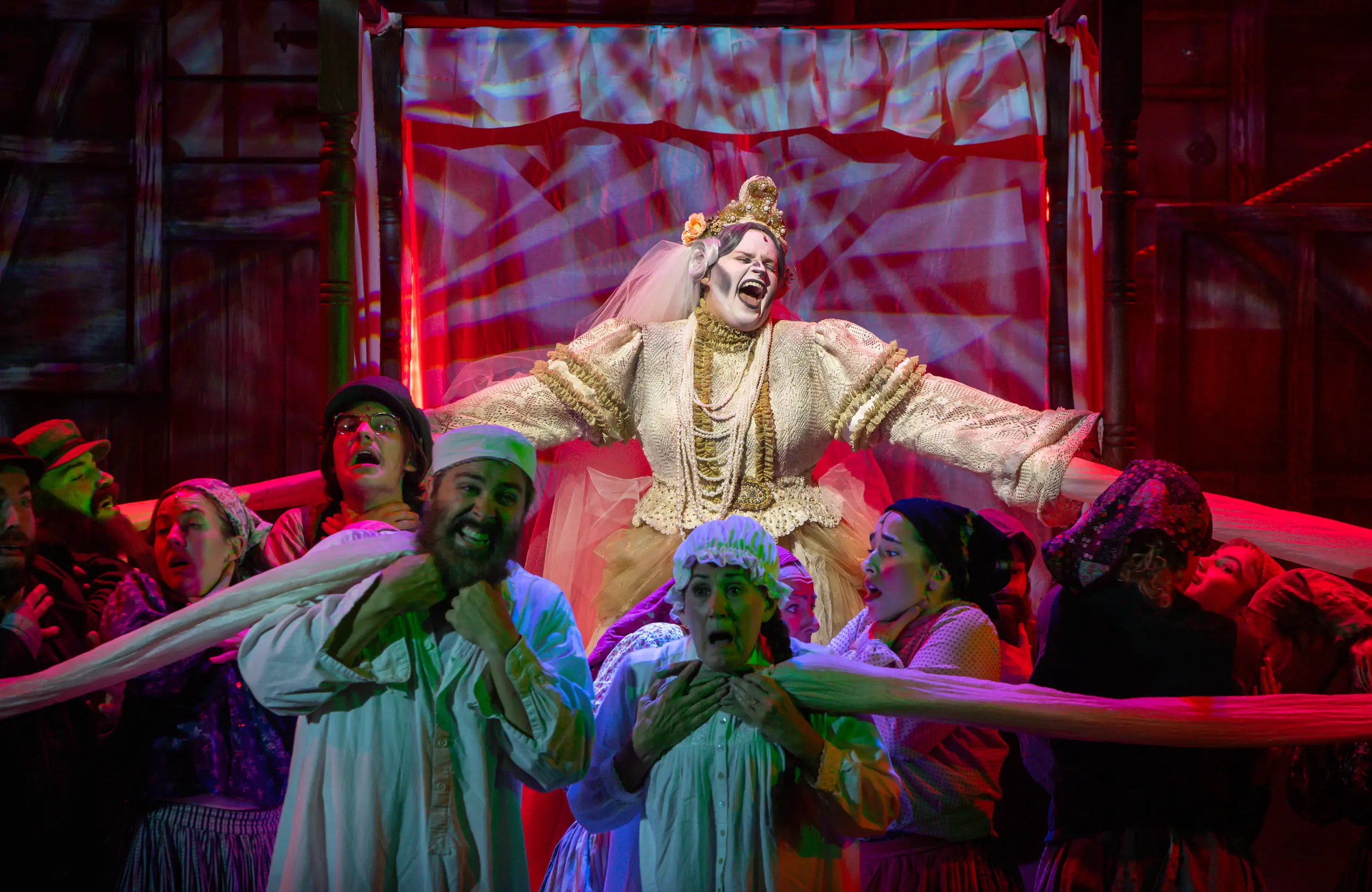 Many actors on stage singing for a Fiddler on the Roof Performance.