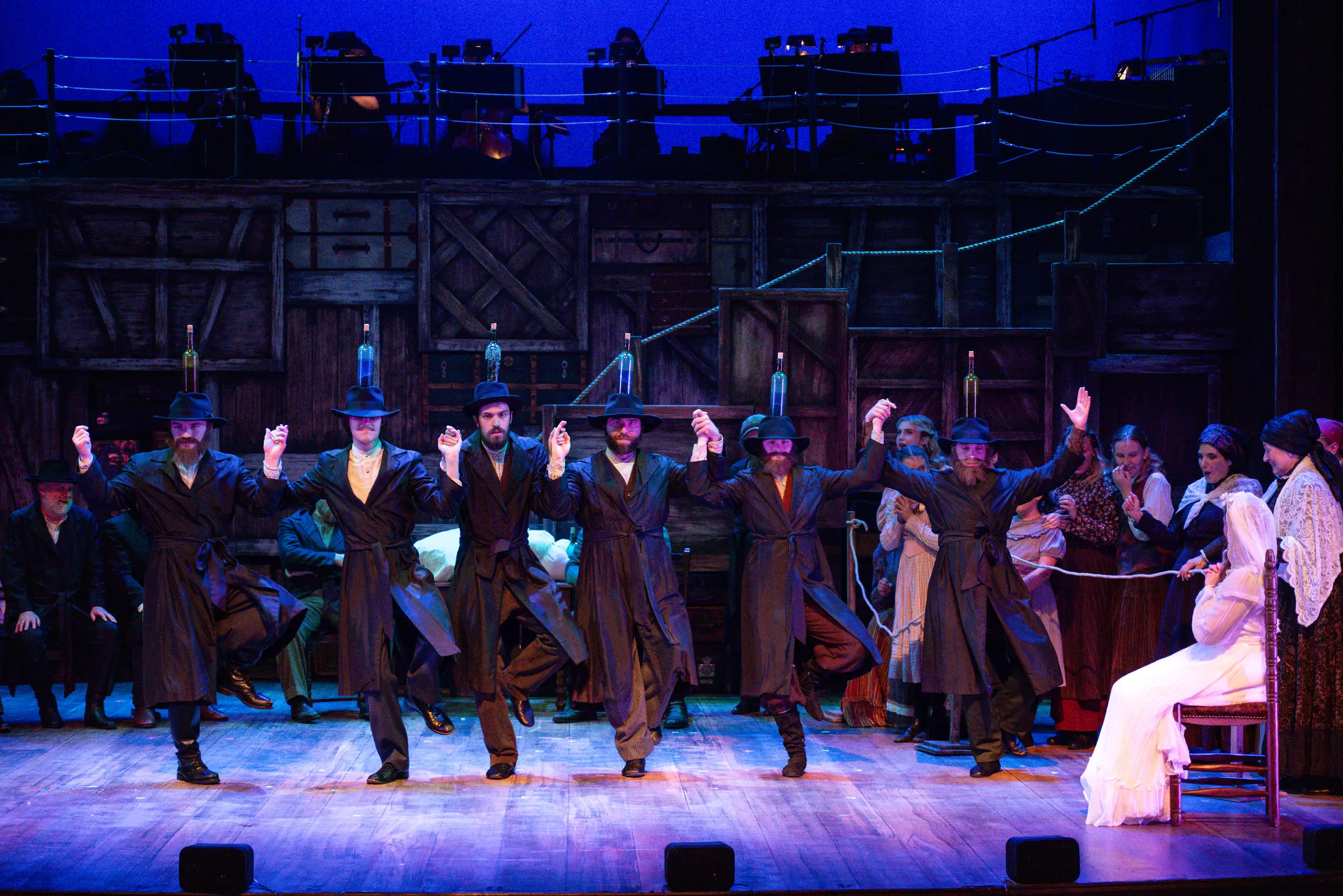 Chorus line of men in hats for a Fiddler on the Roof Performance.