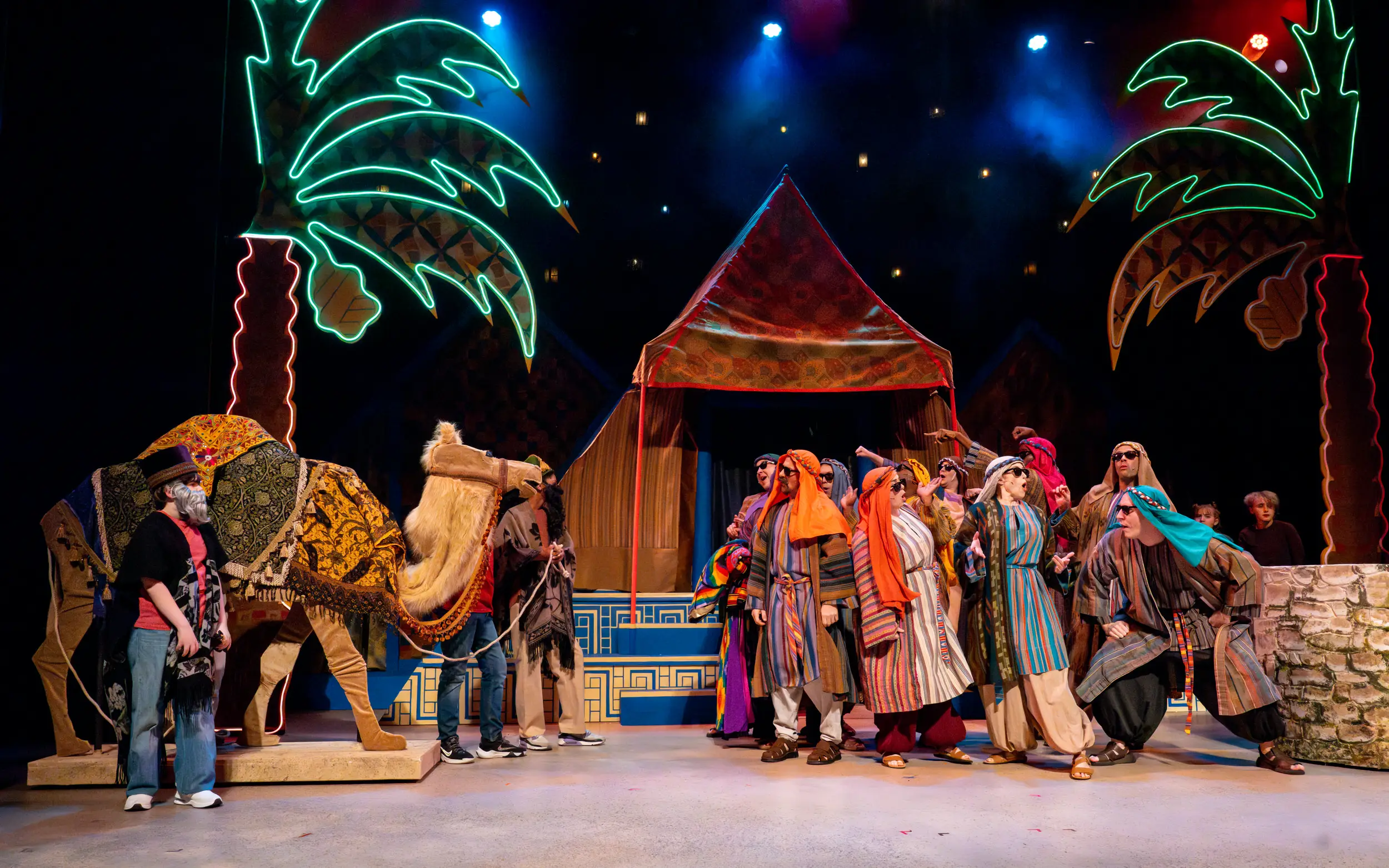 Camel and cast on stage for performance of Joseph and the Technicolor Dreamcoat