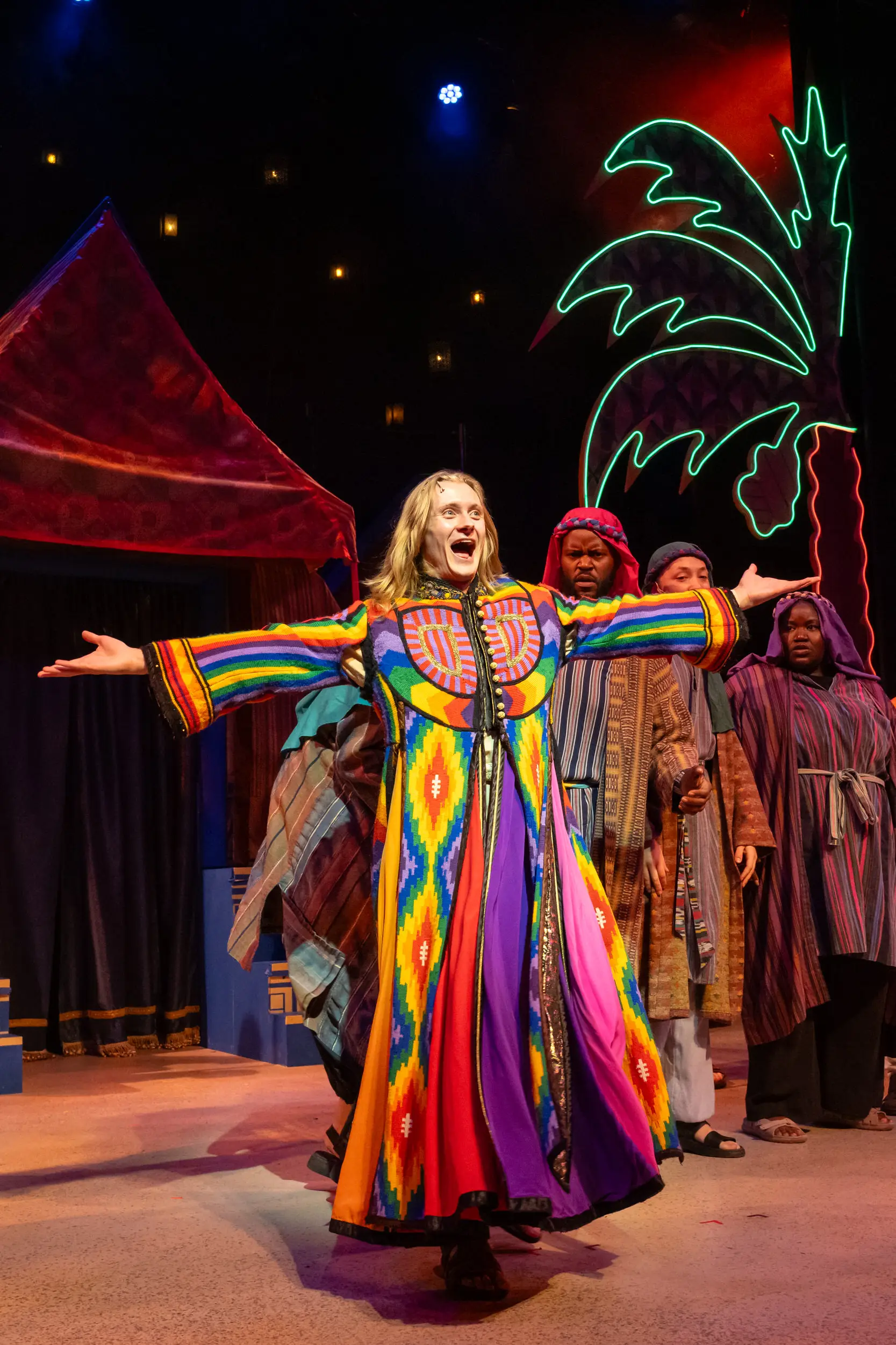 Lead performer on stage for performance of Joseph and the Technicolor Dreamcoat