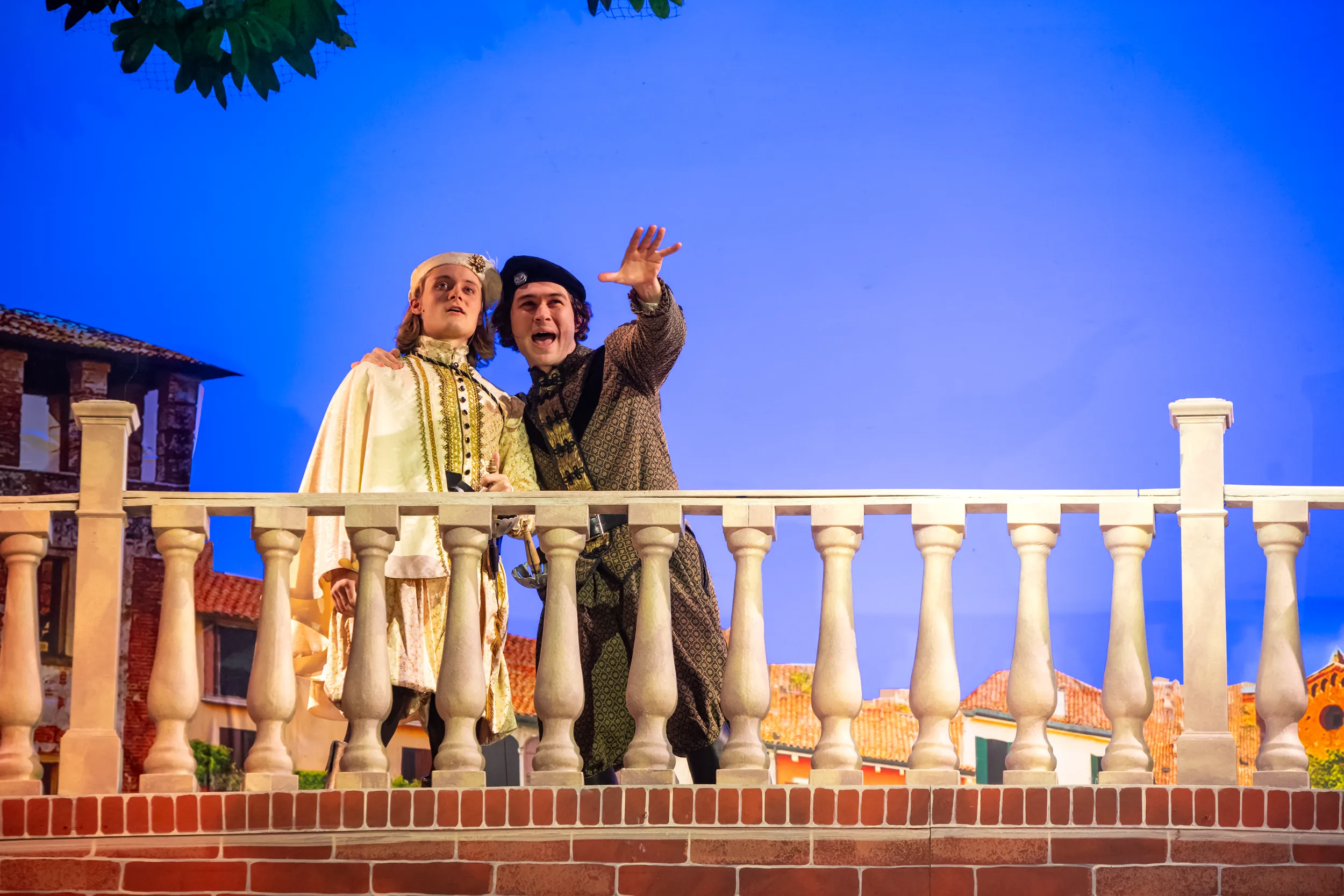 Two men on a balcony during Juliet and Romeo performance.