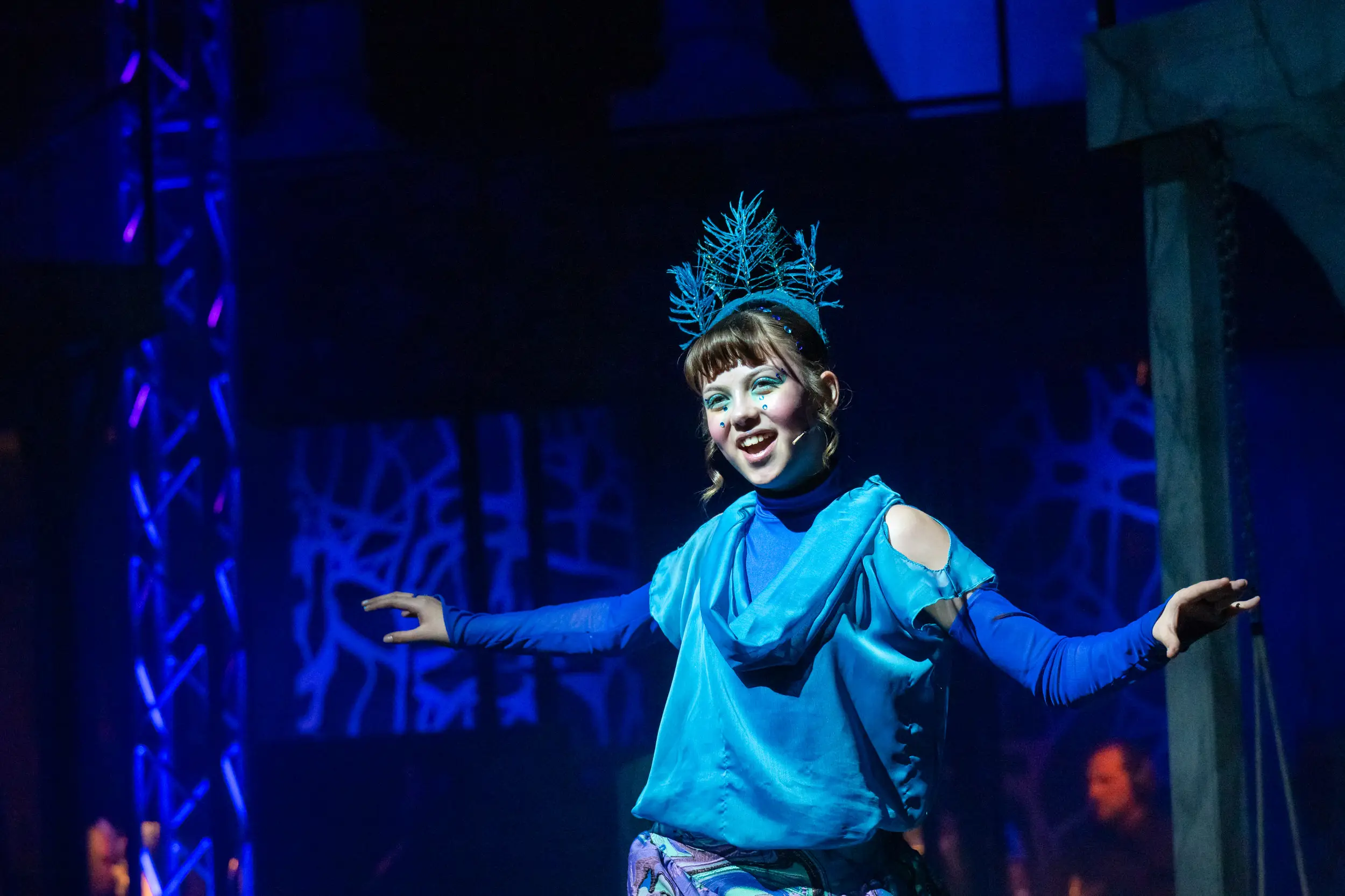 Actress on stage in blue from Midsummer NIghts Dream