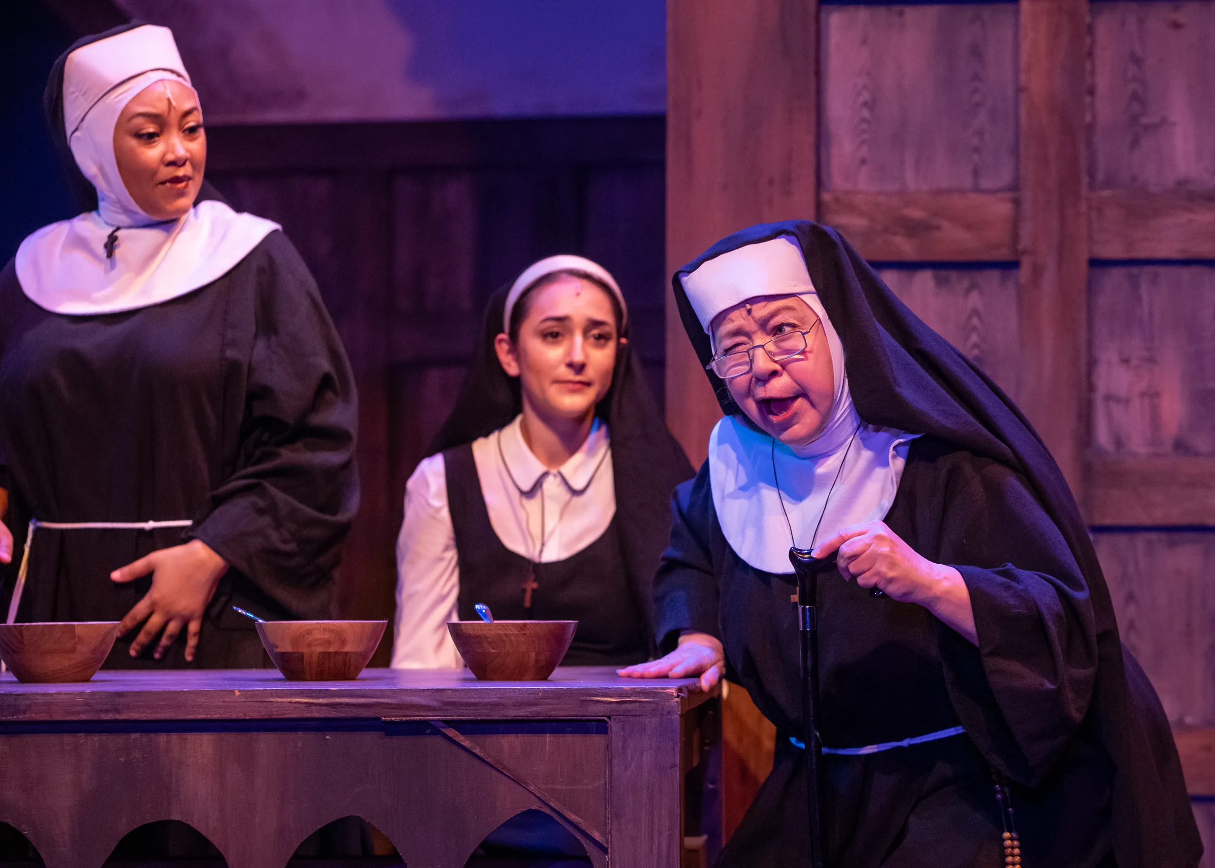 Nuns at a table during Sister act performance