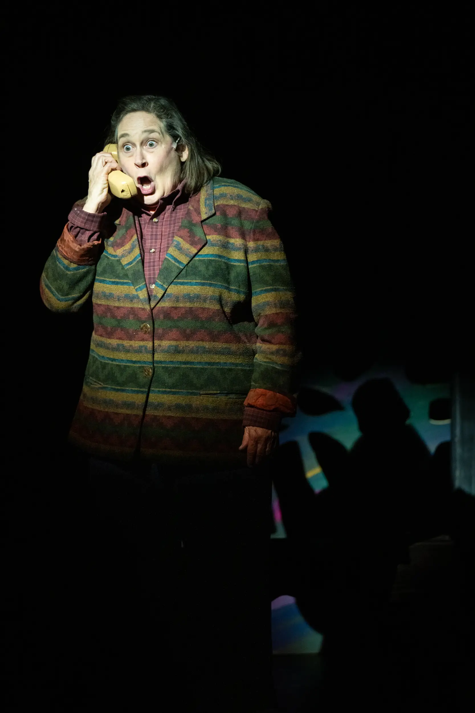 Actor on phone as part of Spitfire Grill performance