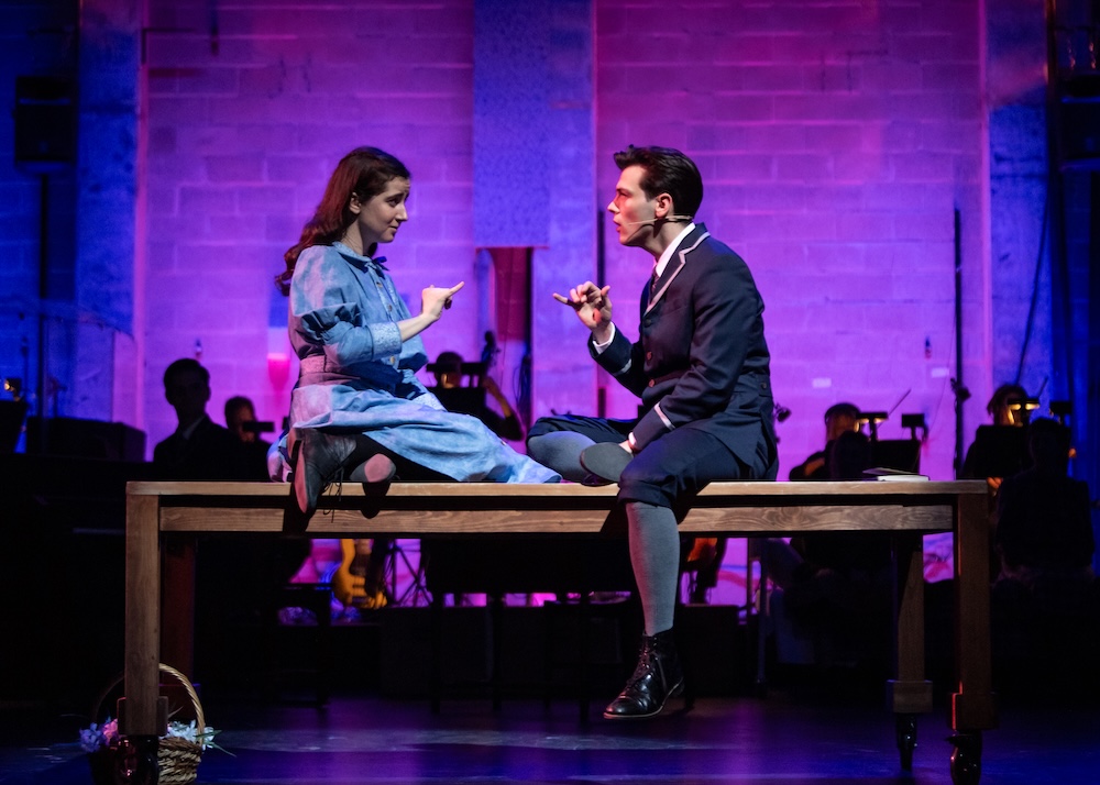Actors signing ASL on stage in Spring Awakening.