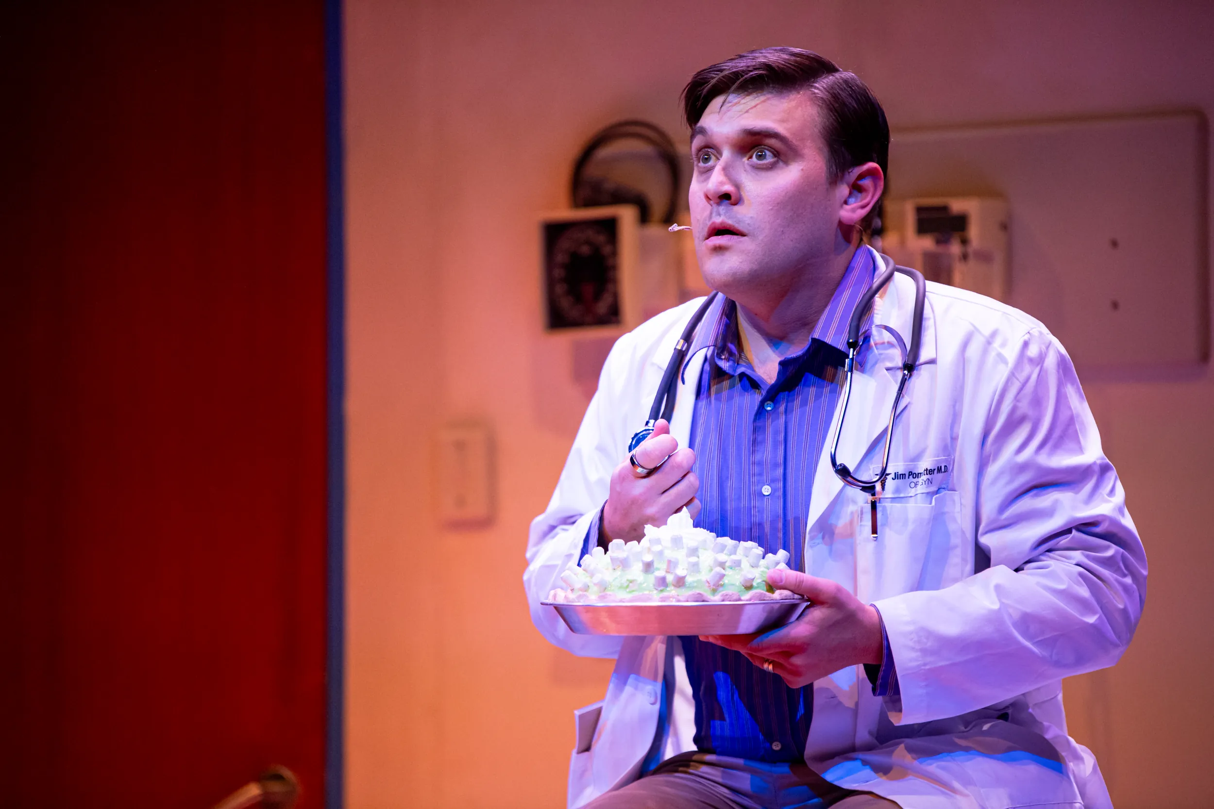 Doctor holding a pie during Waitress performance