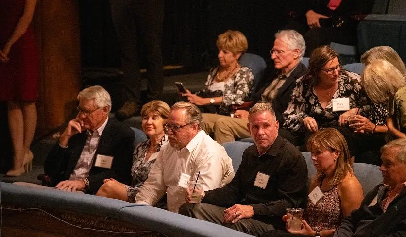 Audience members waiting for a show